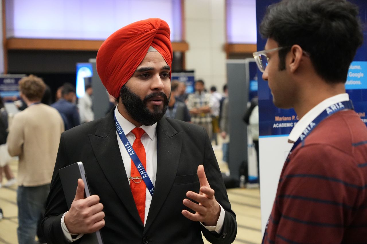 Jaskaran Singh presenting at an AI conference